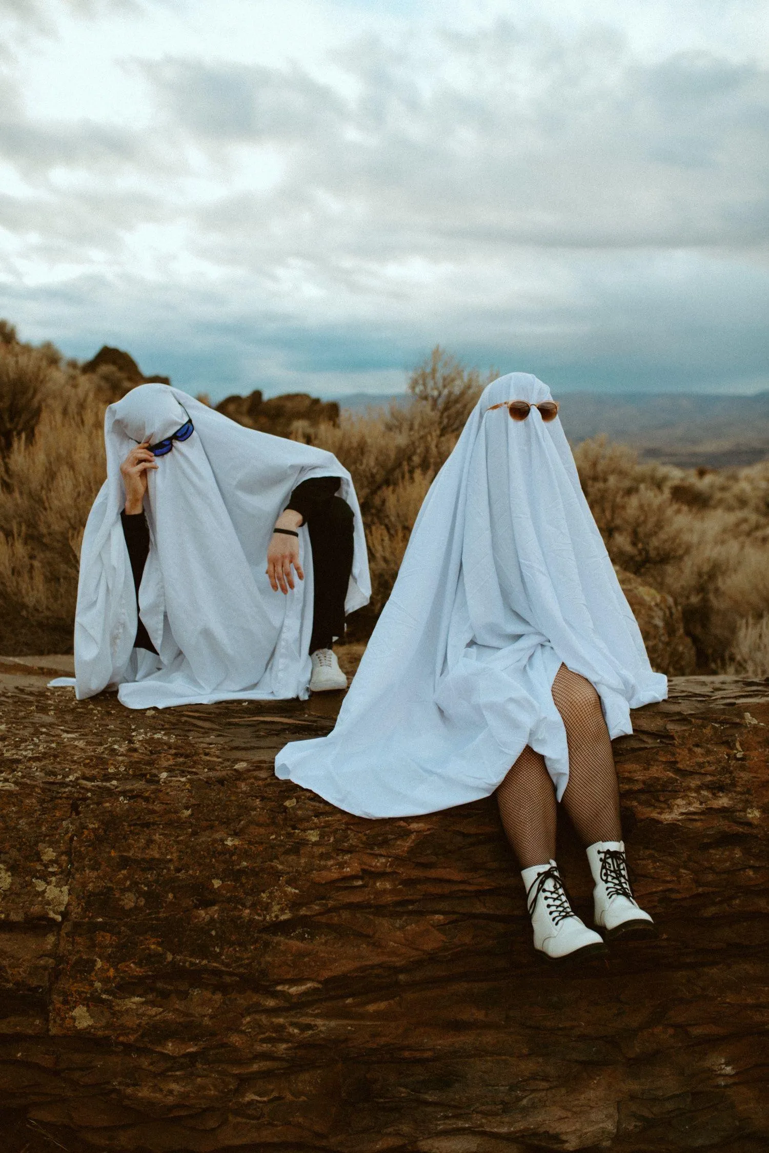 Two Kids Dressed as Ghosts on Rural Halloween Adventure