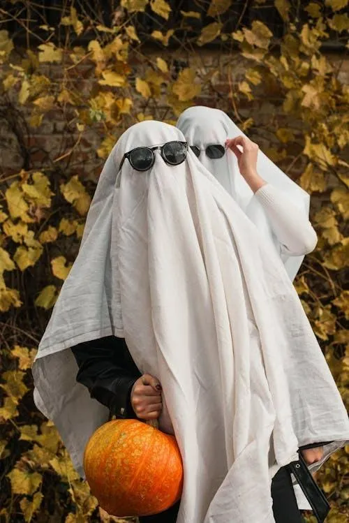 Two People Dressed as Ghosts at Halloween Festival HD