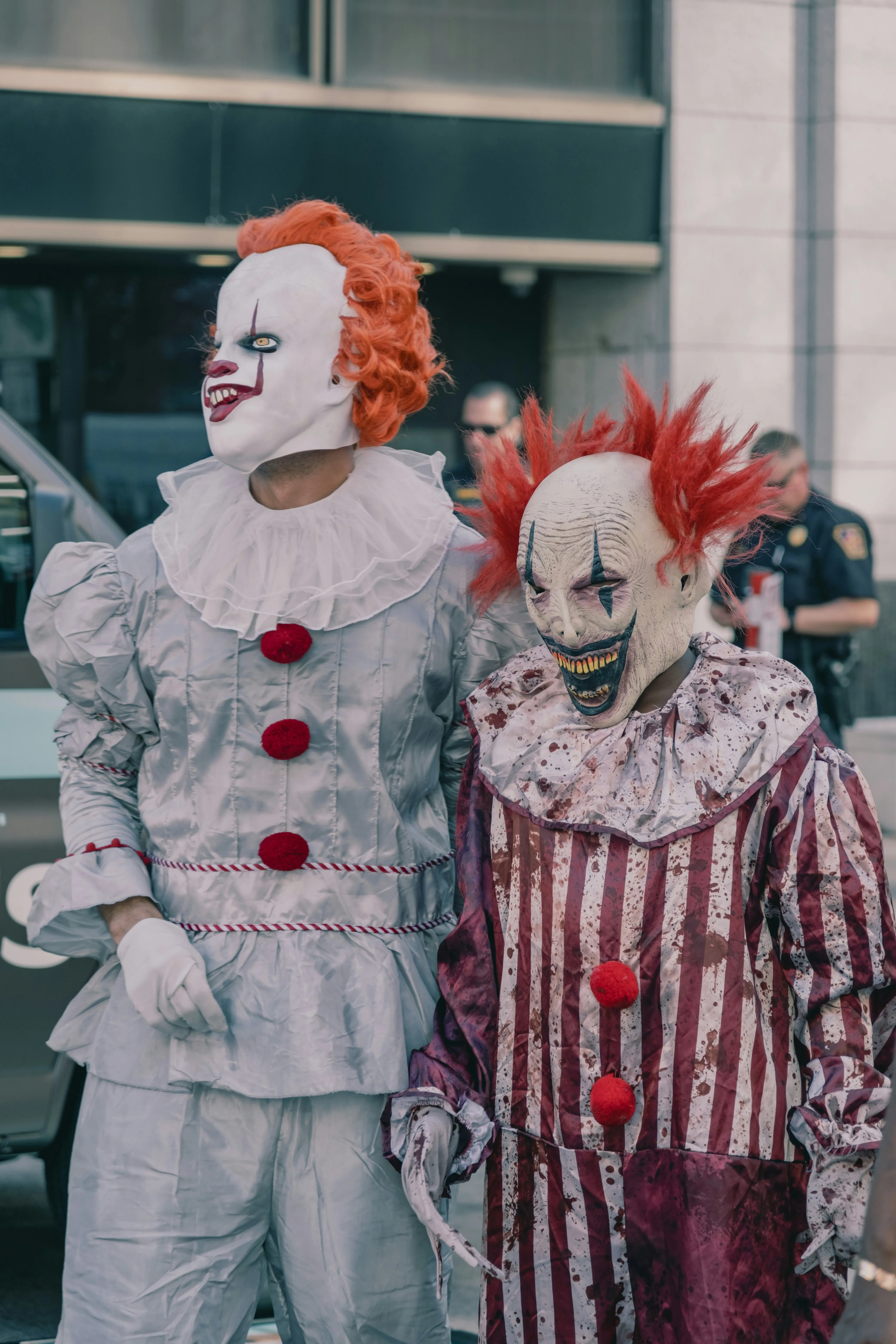 Two People Dressed as Scary Clowns at Halloween Event