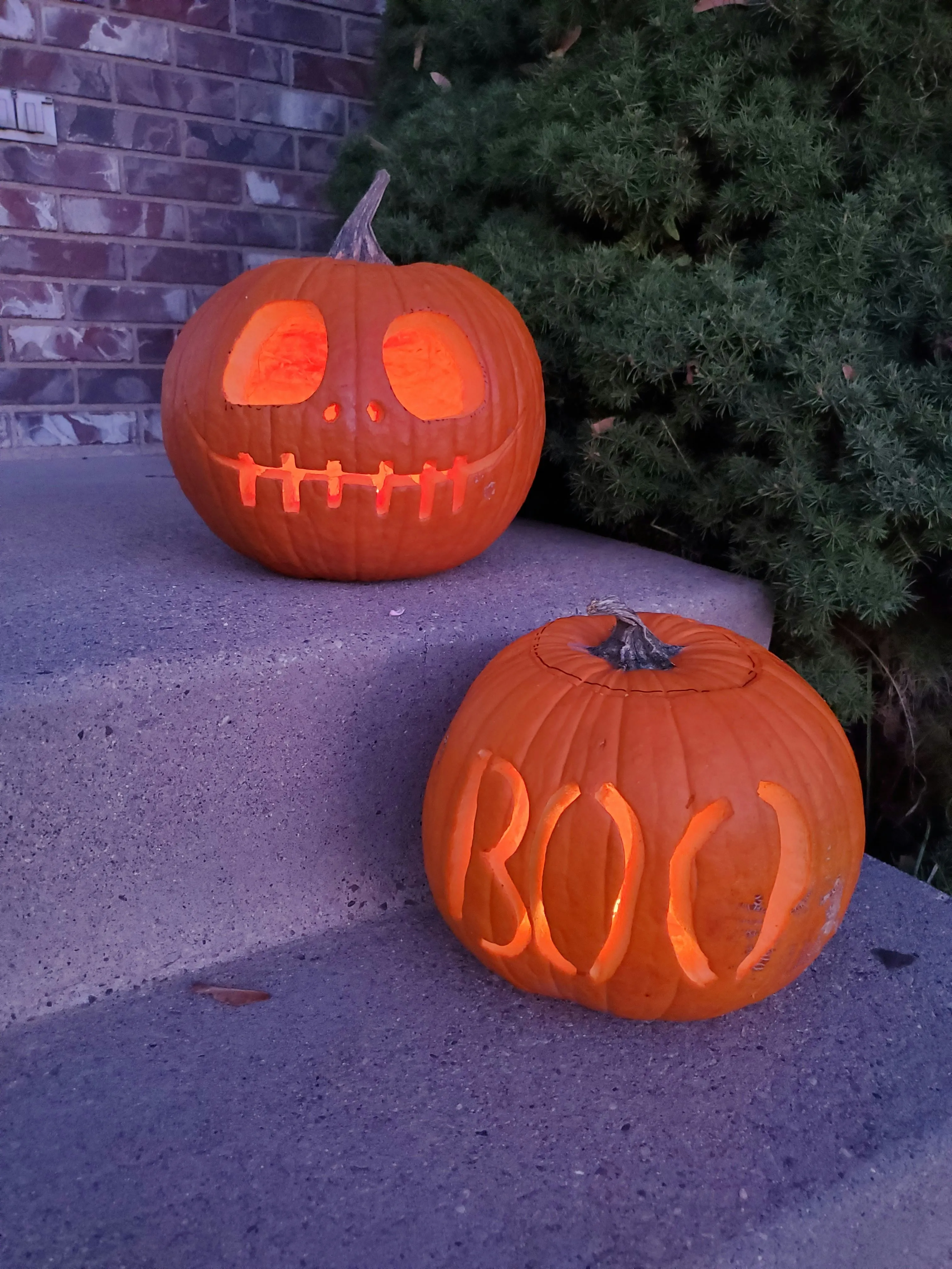 Two Pumpkins on Doorstep with Boo Carving Wallpaper HD
