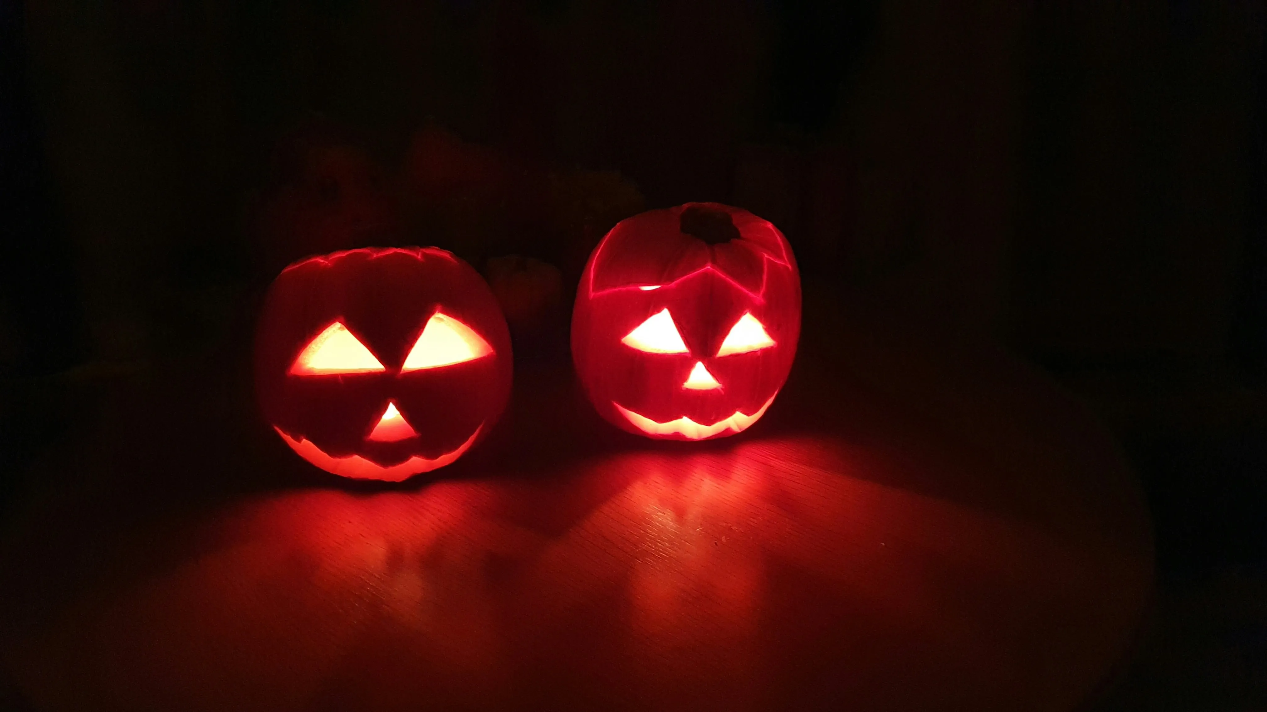Two Simple Jack O Lanterns Glowing in The Dark Wallpaper