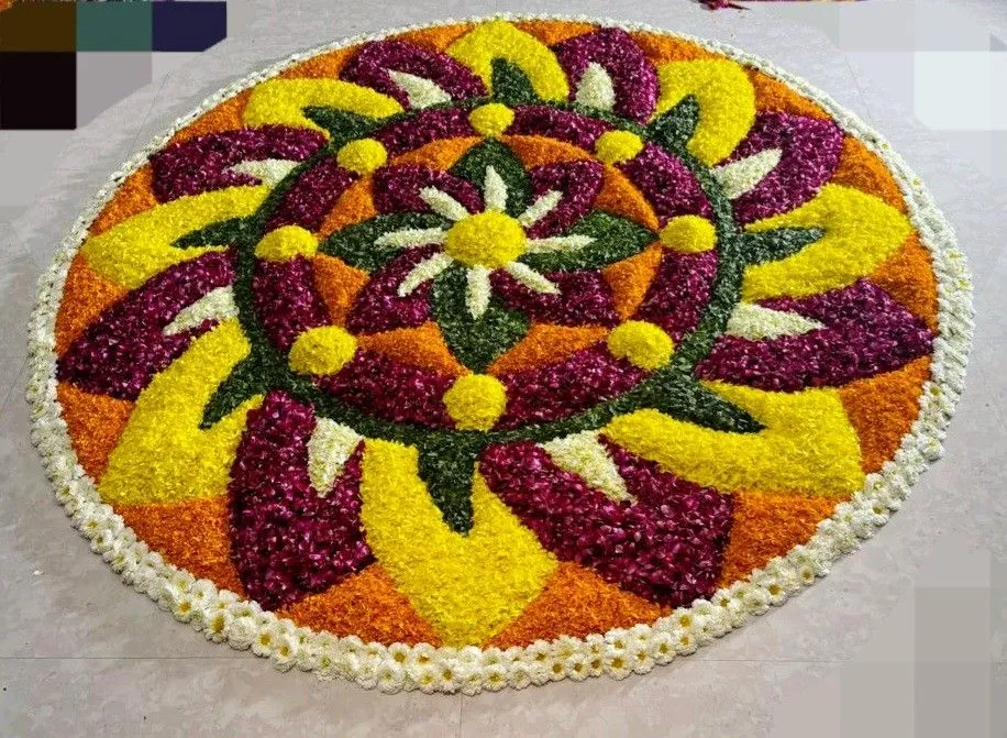 Vibrant circular Onam pookolam with flower petal pattern