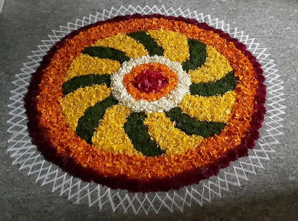 Vibrant Circular Pookalam with swirling Leaf pattern image