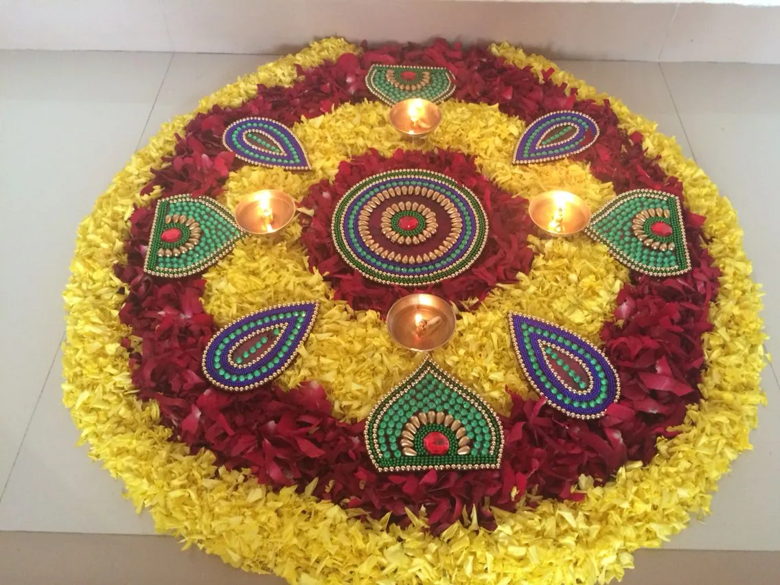 Vibrant colourful Athapookolam with flowers and beads design
