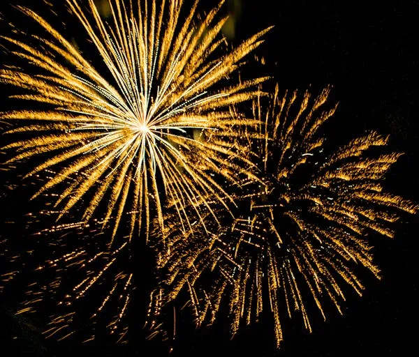 Vibrant Fireworks in the Sky over a Busy Urban Area HD