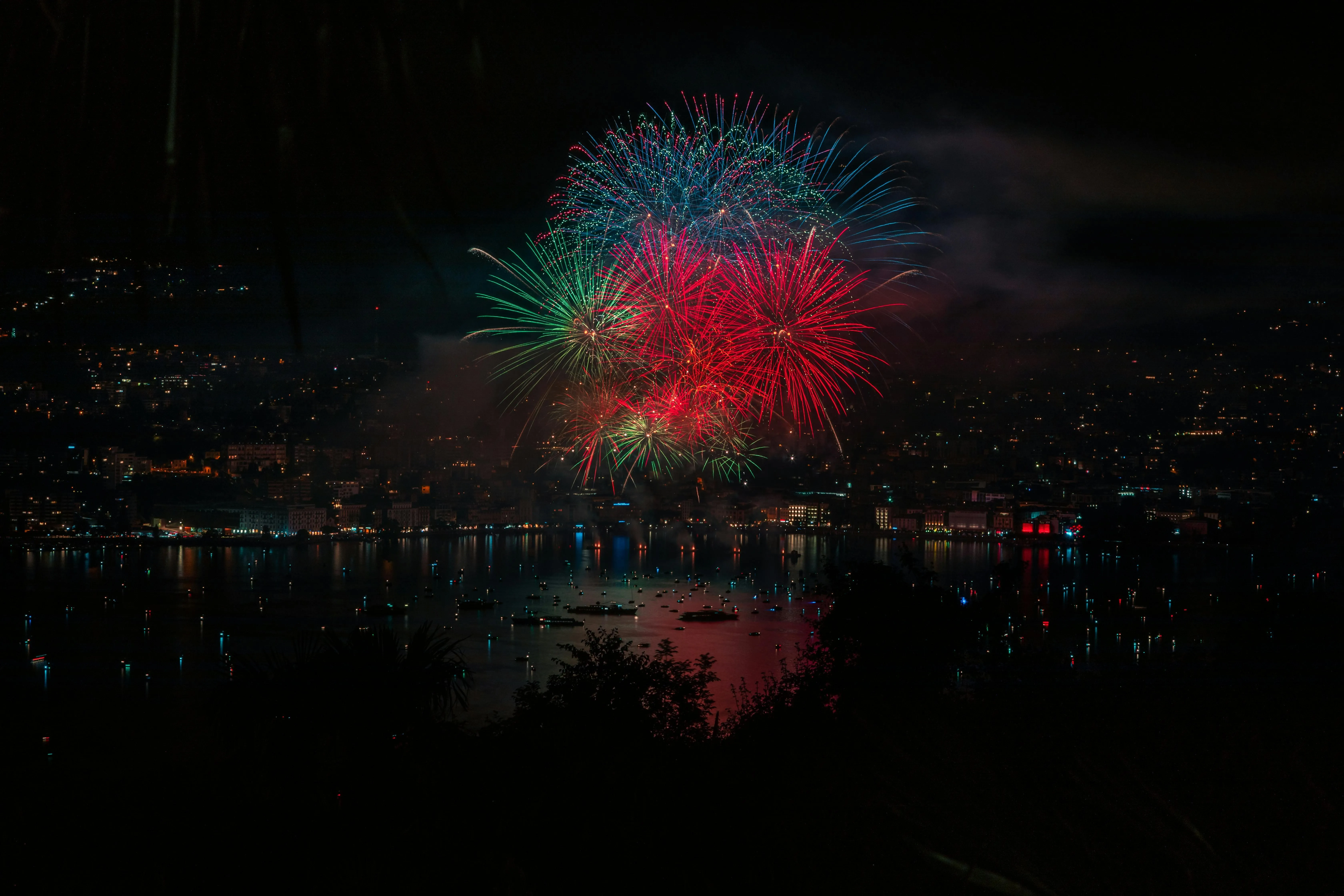 Vibrant Fireworks Light up the Night Sky above City image