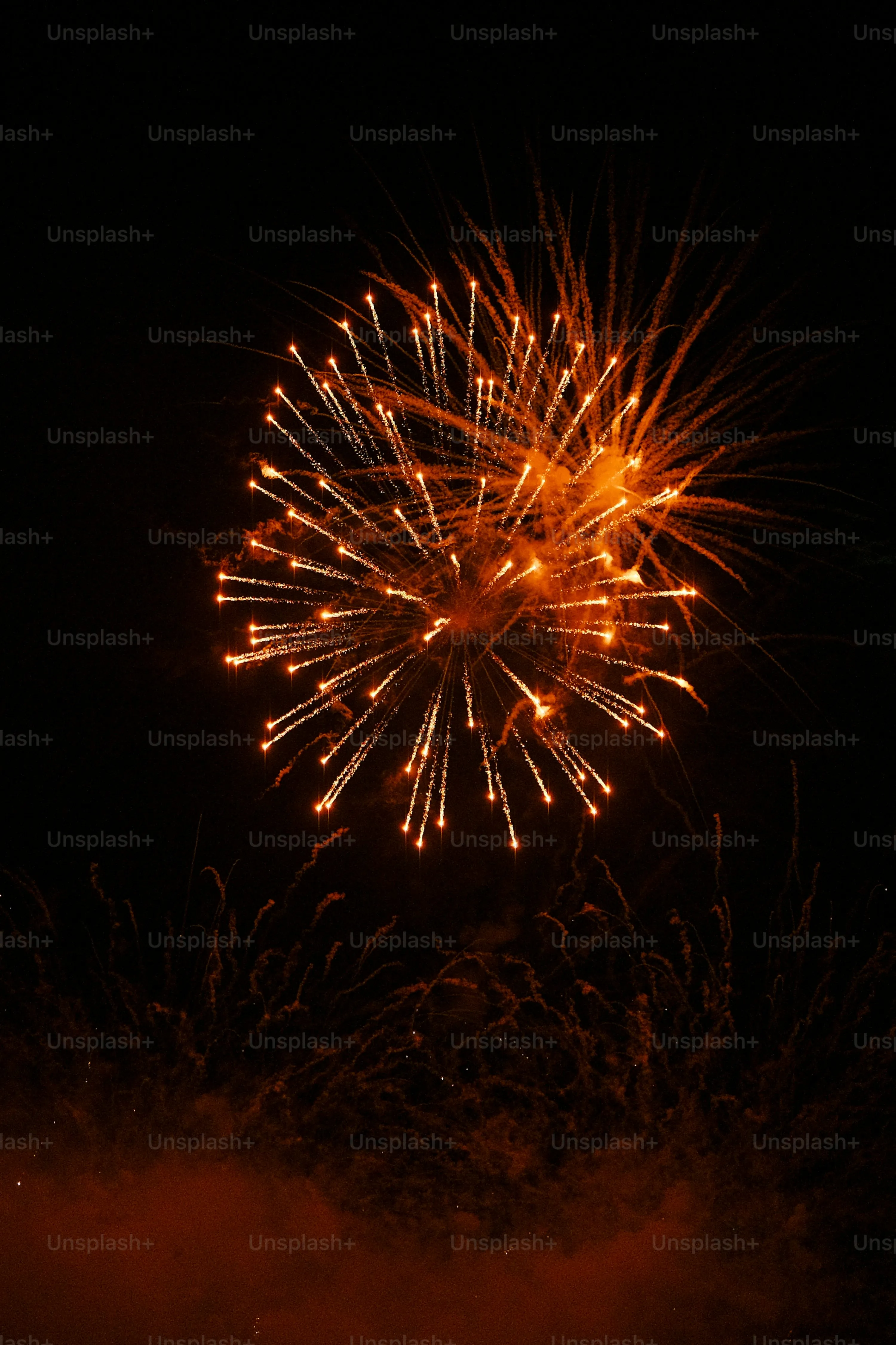 Vibrant Fireworks Lighting up the Urban Skyline Wallpaper