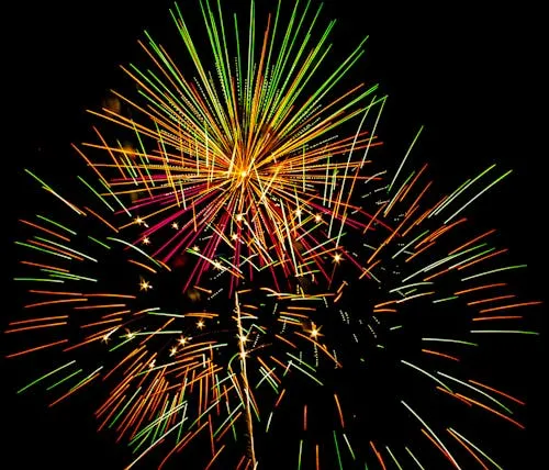 Vibrant Fireworks Spreading Across the Sky Wallpaper