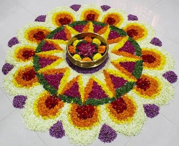 Vibrant floral rangoli design with symmetrical patterns