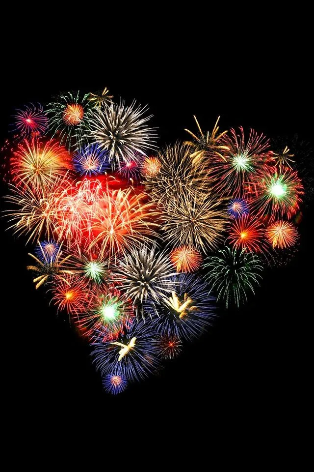 Vibrant Heart Shaped Fireworks Display In The Dark image