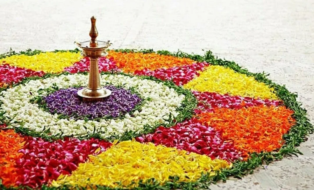 Vibrant pookolam with a central lamp and petal design image