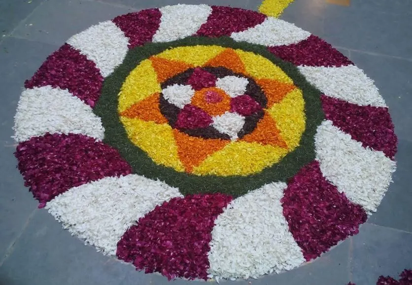 Vibrant spiral pookolam with star design for Onam festival