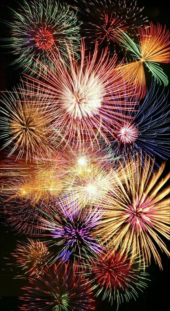 Vivid celebration with layered fireworks in all directions