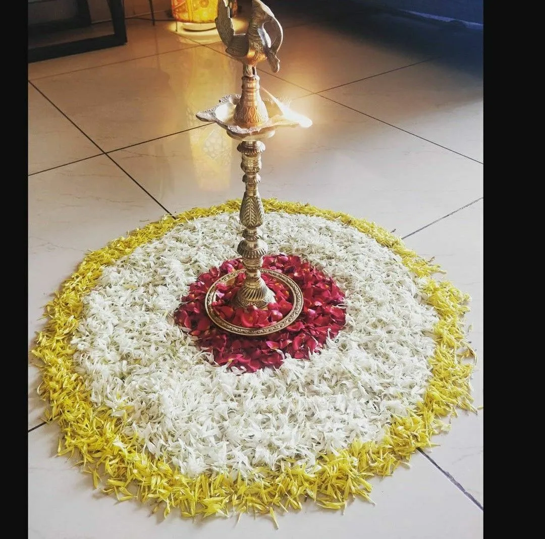 White and Yellow Floral Athapookolam with Brass Lamp image