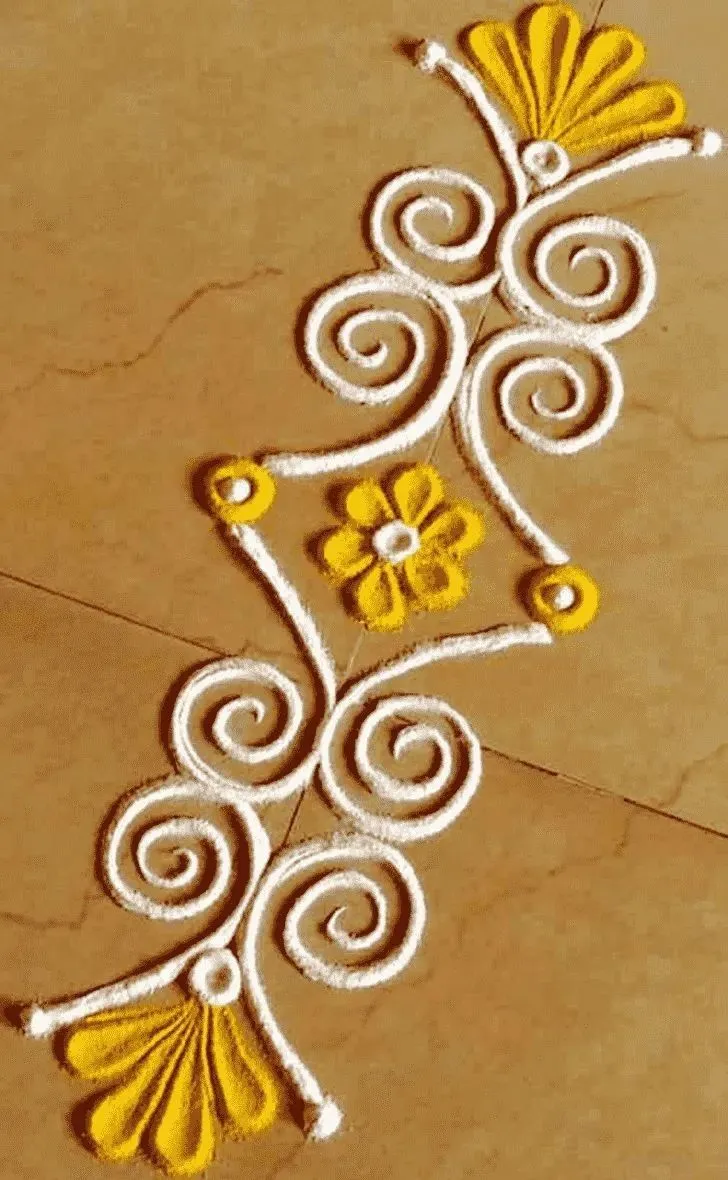 White and yellow kolam design for Onam with swirls image