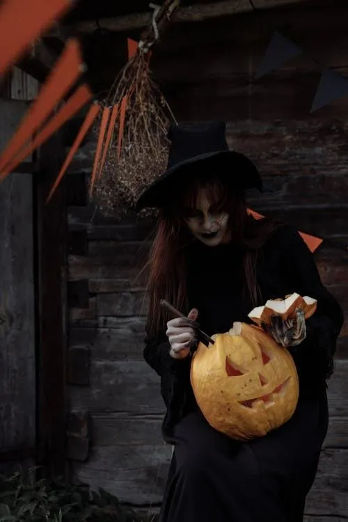 Witch Holding Pumpkin Lantern in Dark Rustic Setting