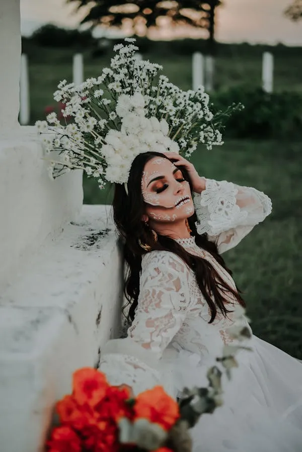 Woman Dressed as Bride with Halloween Makeup and Flowers