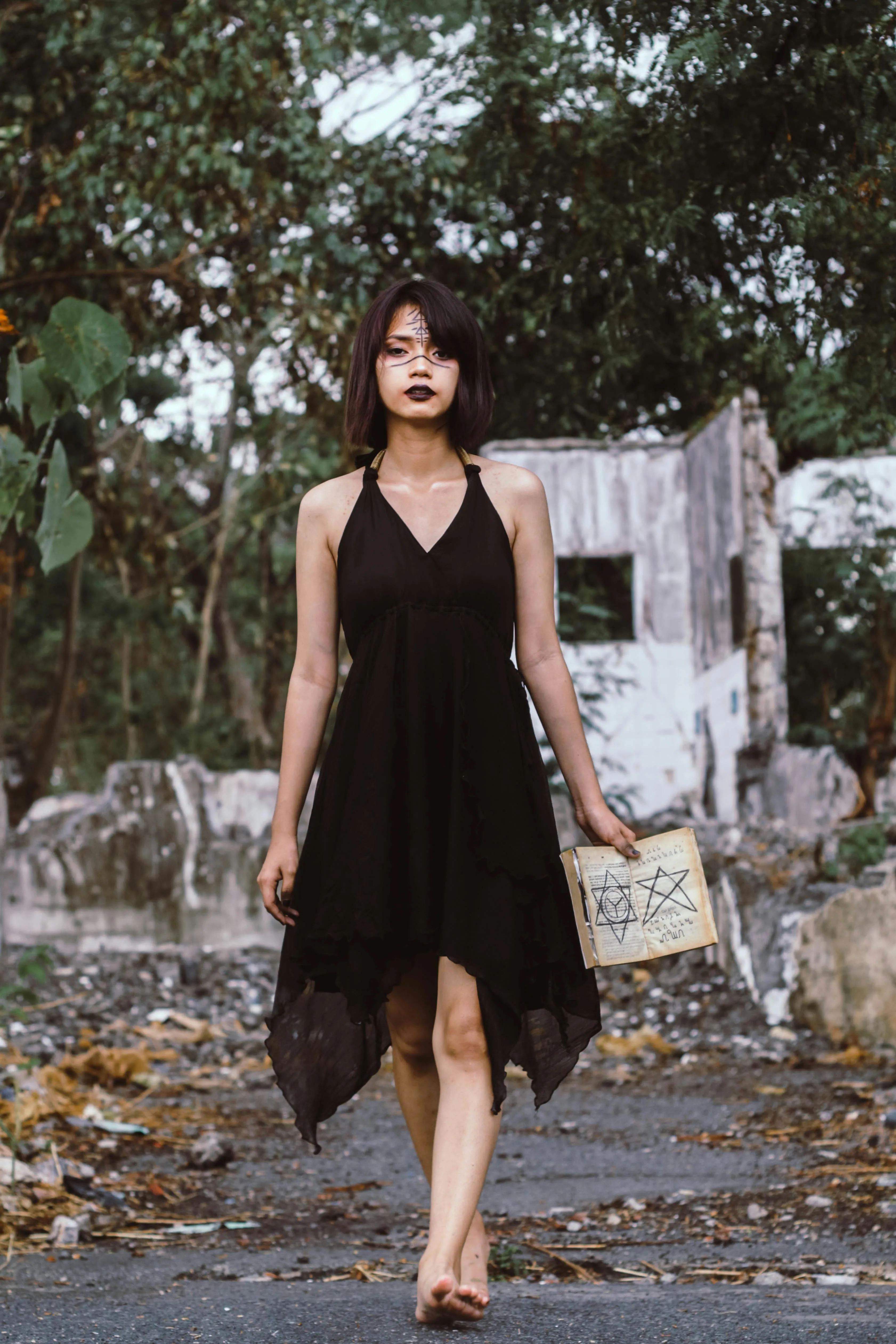 Woman in Black Dress Walking Through Cemetery Wallpaper