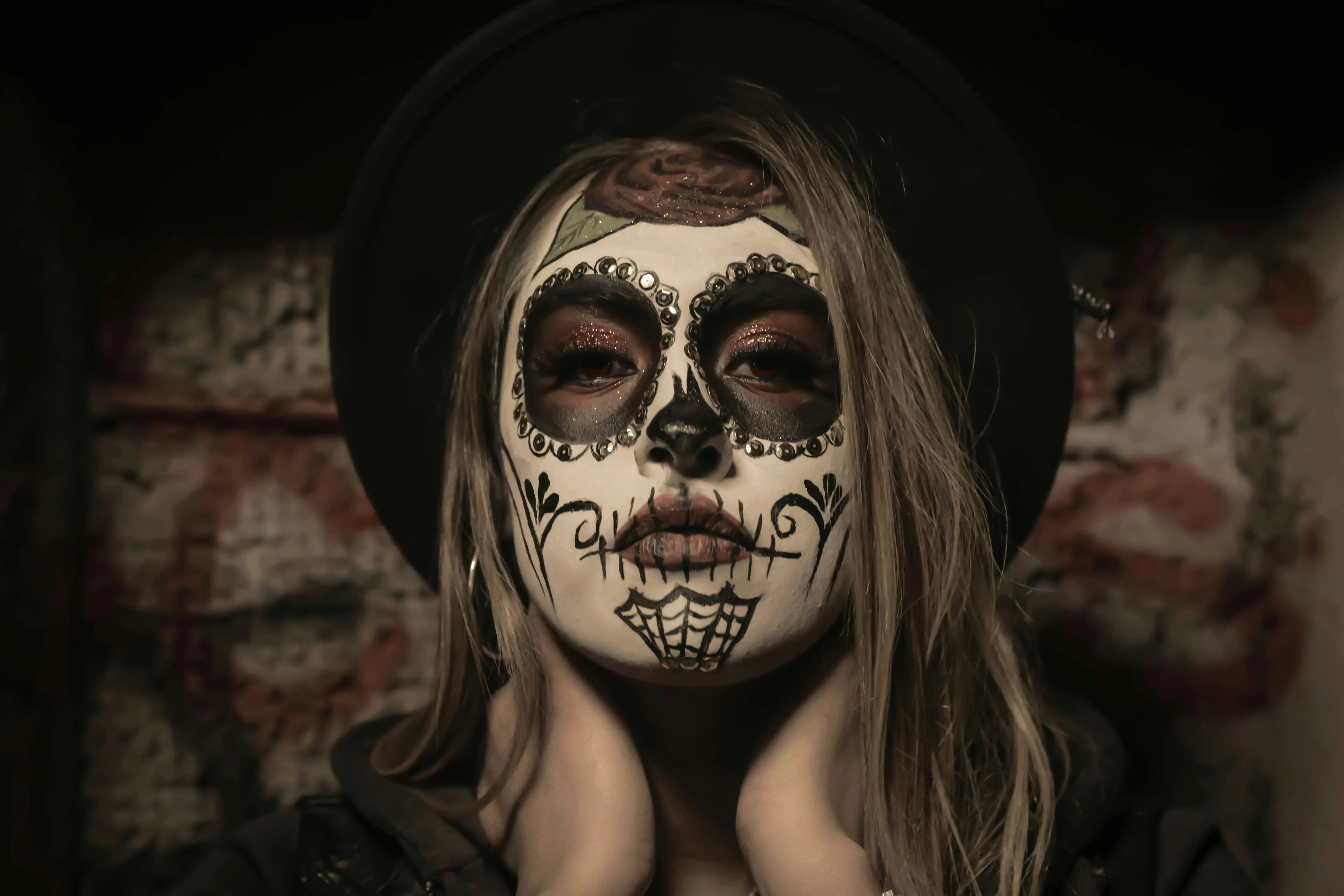 Woman in Black Dress with Skeleton Face Paint Wallpaper