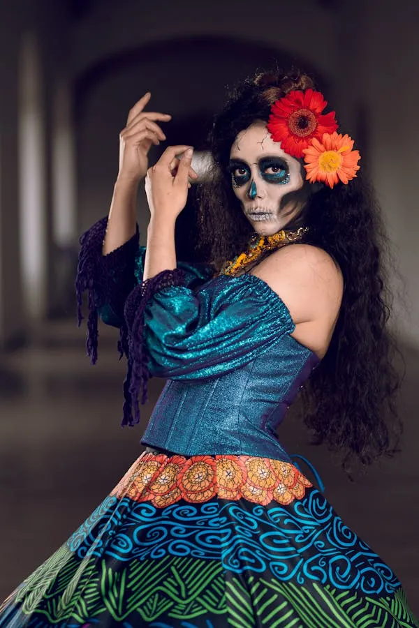 Woman in Colorful Dress with Sugar Skull Makeup posing image