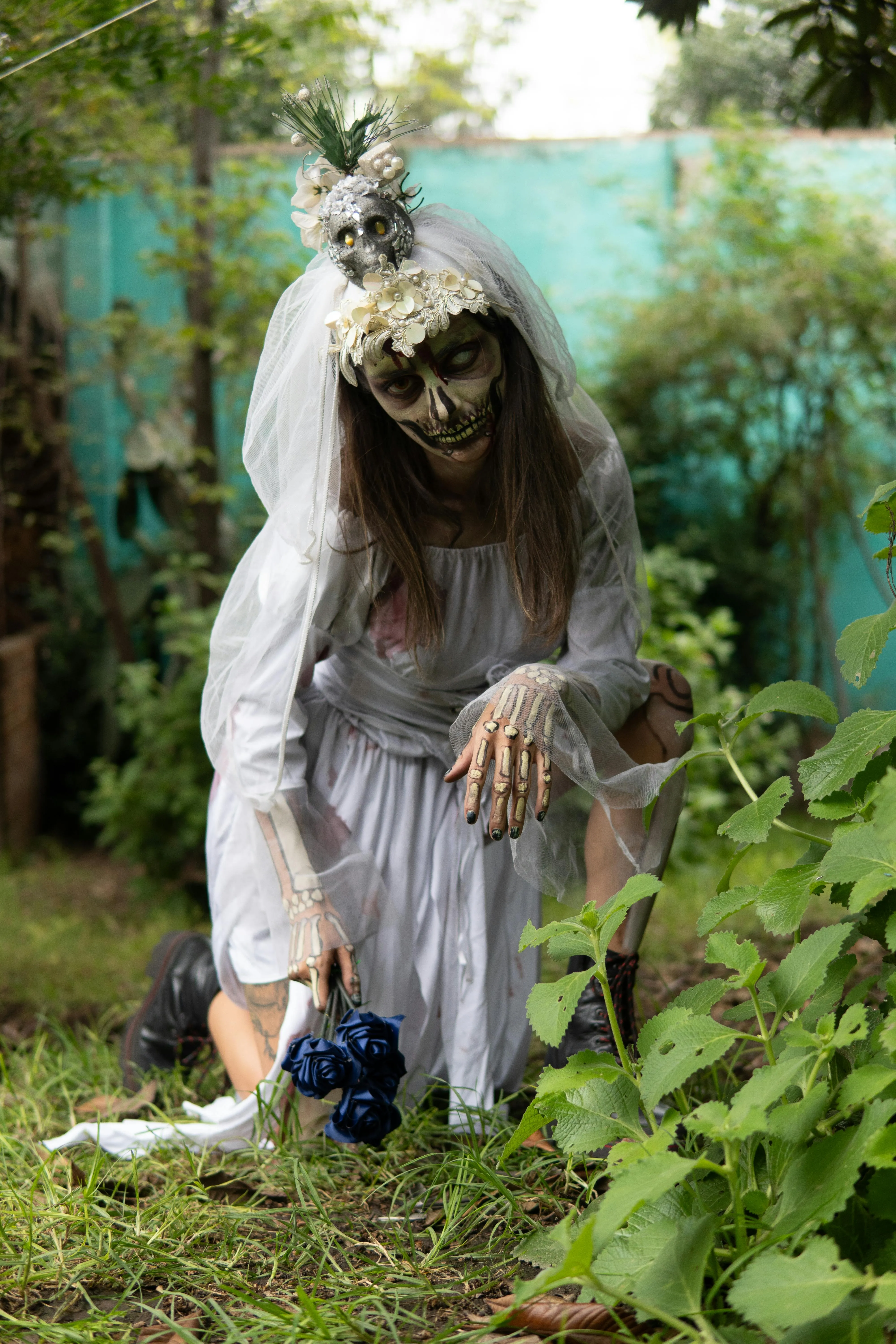 Woman in Creepy Ghost Costume in Garden Setting image