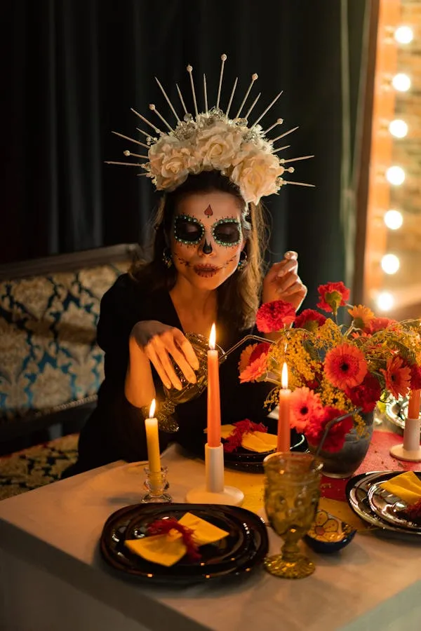 Woman in Day of Death Makeup at Candlelit Table image