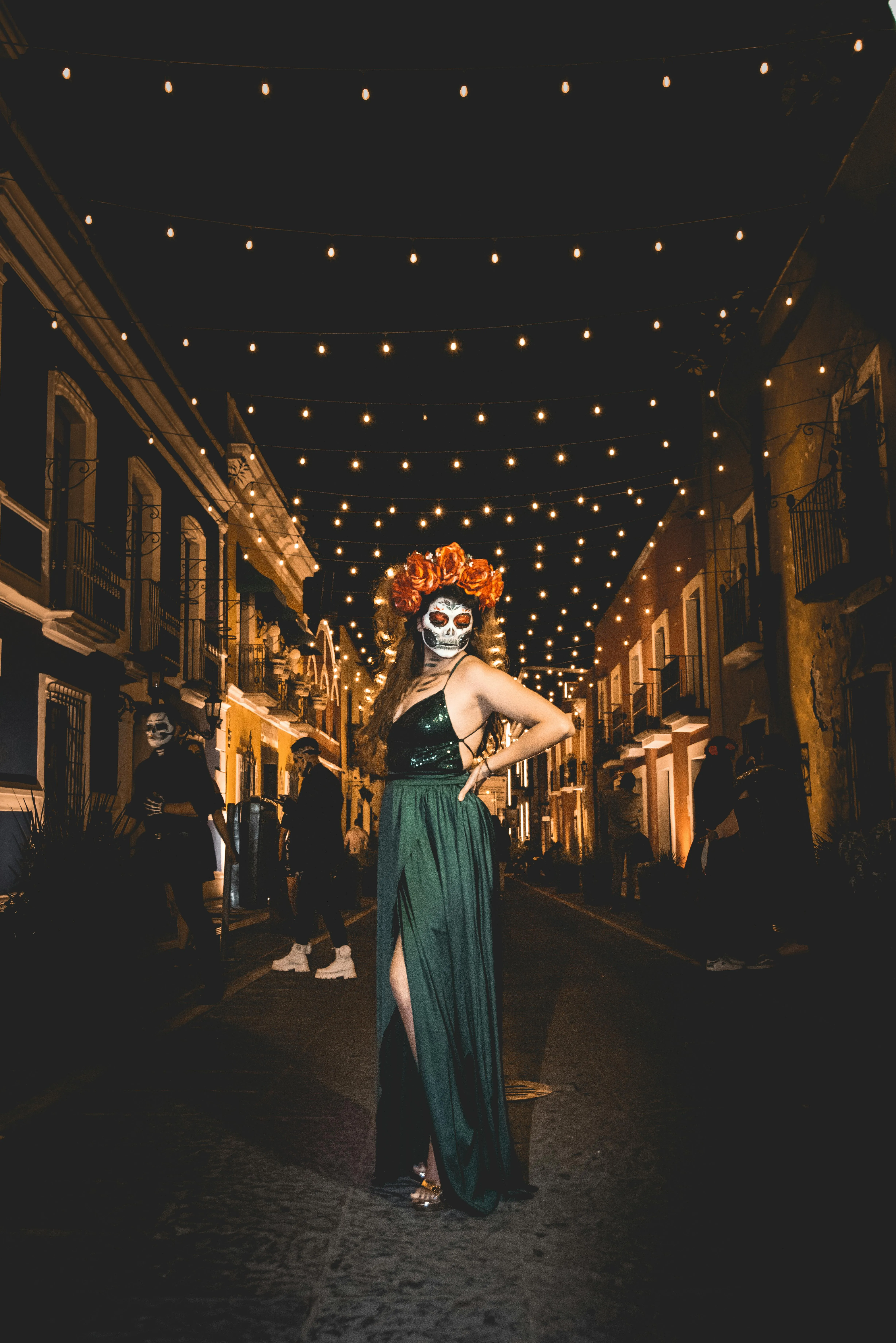 Woman in Elegant Dress at Halloween Night Festival