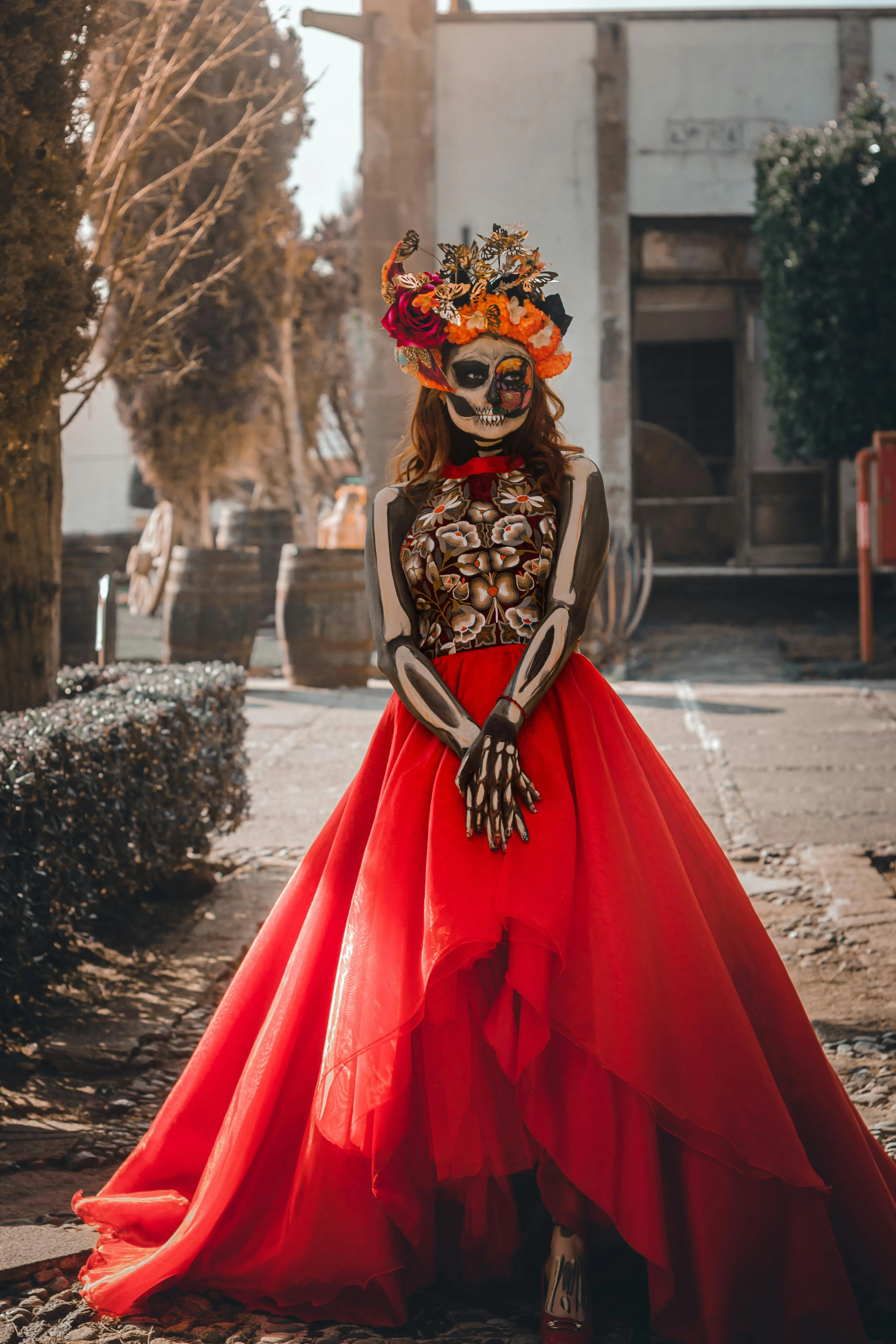 Woman in Elegant Red Dress with Skeleton Makeup image