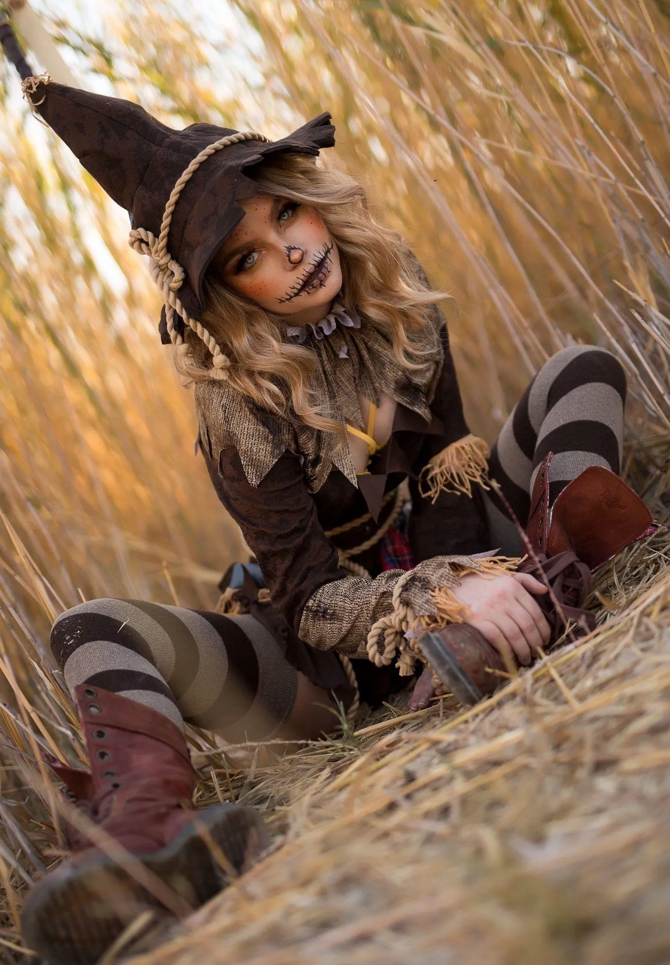 Woman in Fall Attire with Striped Tights in Field Wallpaper