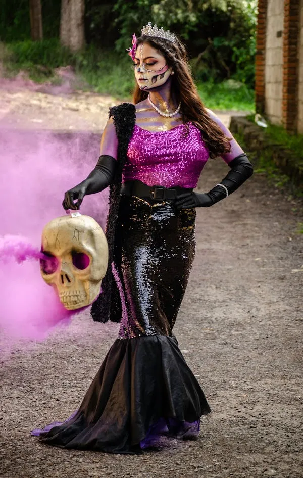 Woman in Gothic Dress Holding Skull with Pink Smoke Effect