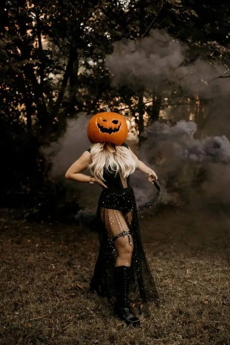 Woman in Halloween Costume with Smoke Effect Outside image