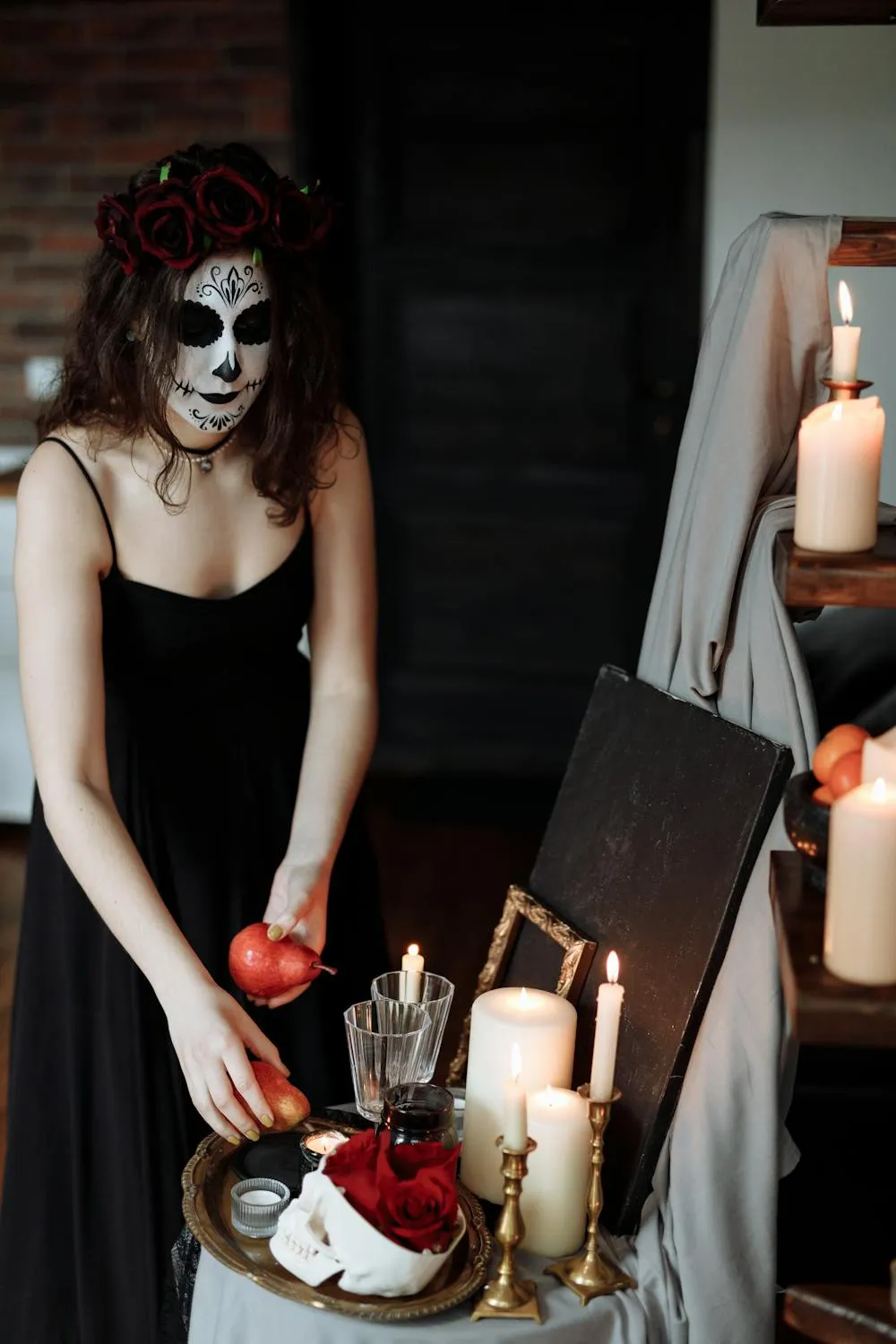 Woman in Halloween Makeup with Candle and Apple Wallpaper