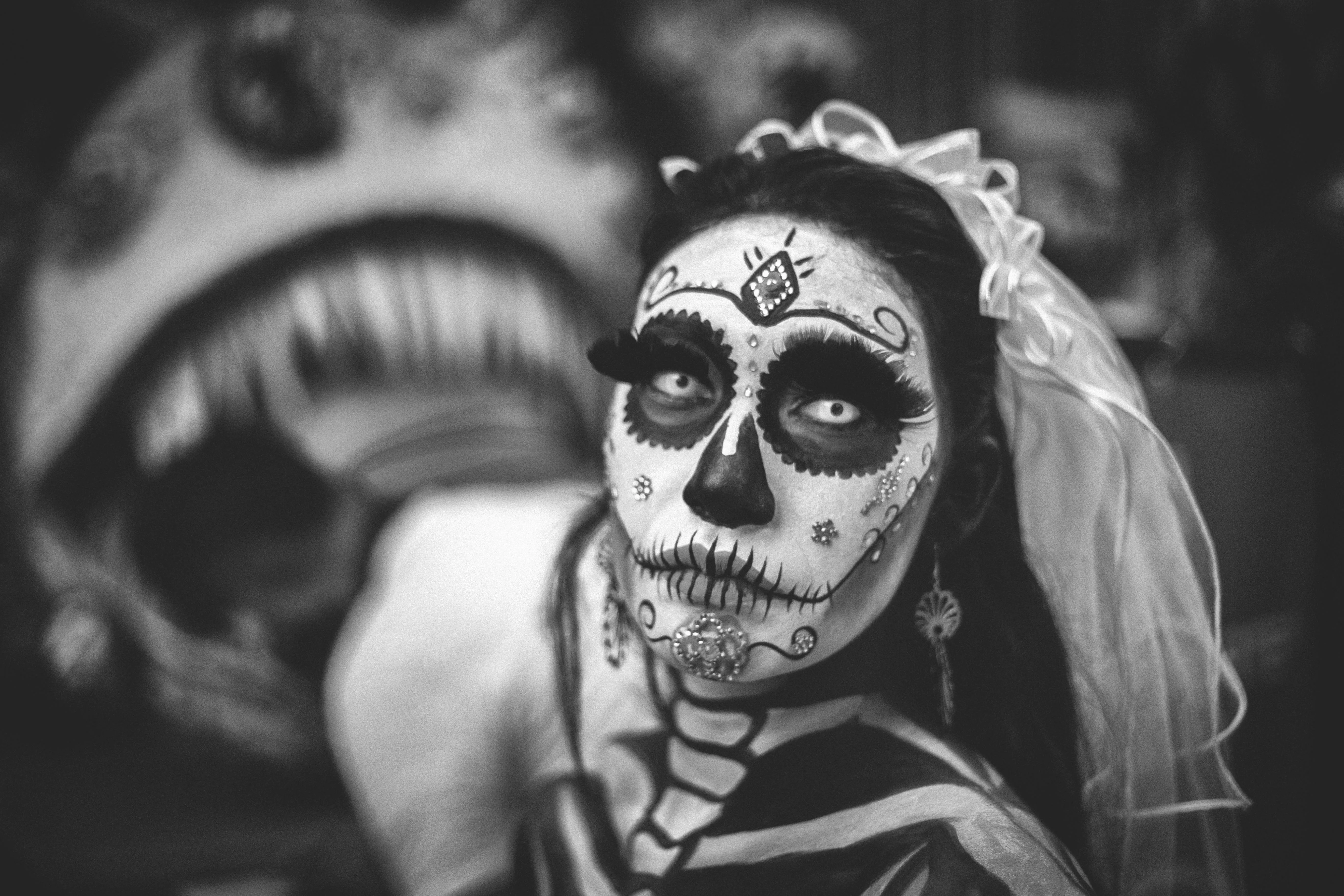 Woman in Skull Makeup Posing at Halloween Festival image
