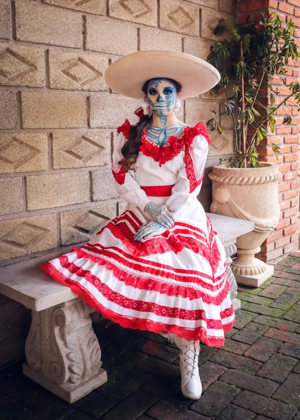 Woman in Traditional Dress Sitting Outdoors for Halloween