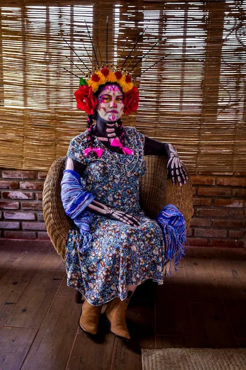 Woman in Traditional Dress with Floral Headpiece Sitting