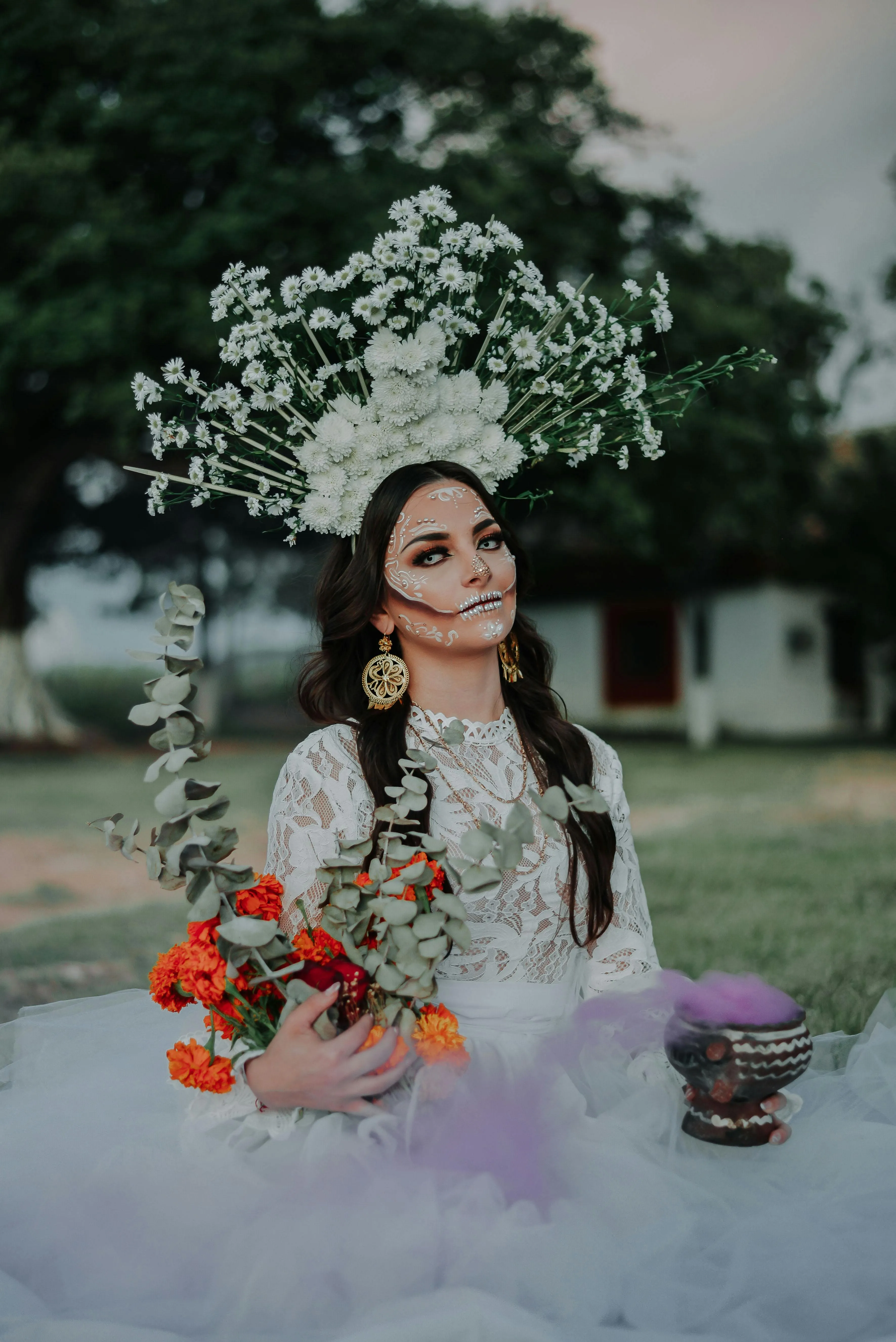 Woman in White Dress with Halloween Floral Decoration