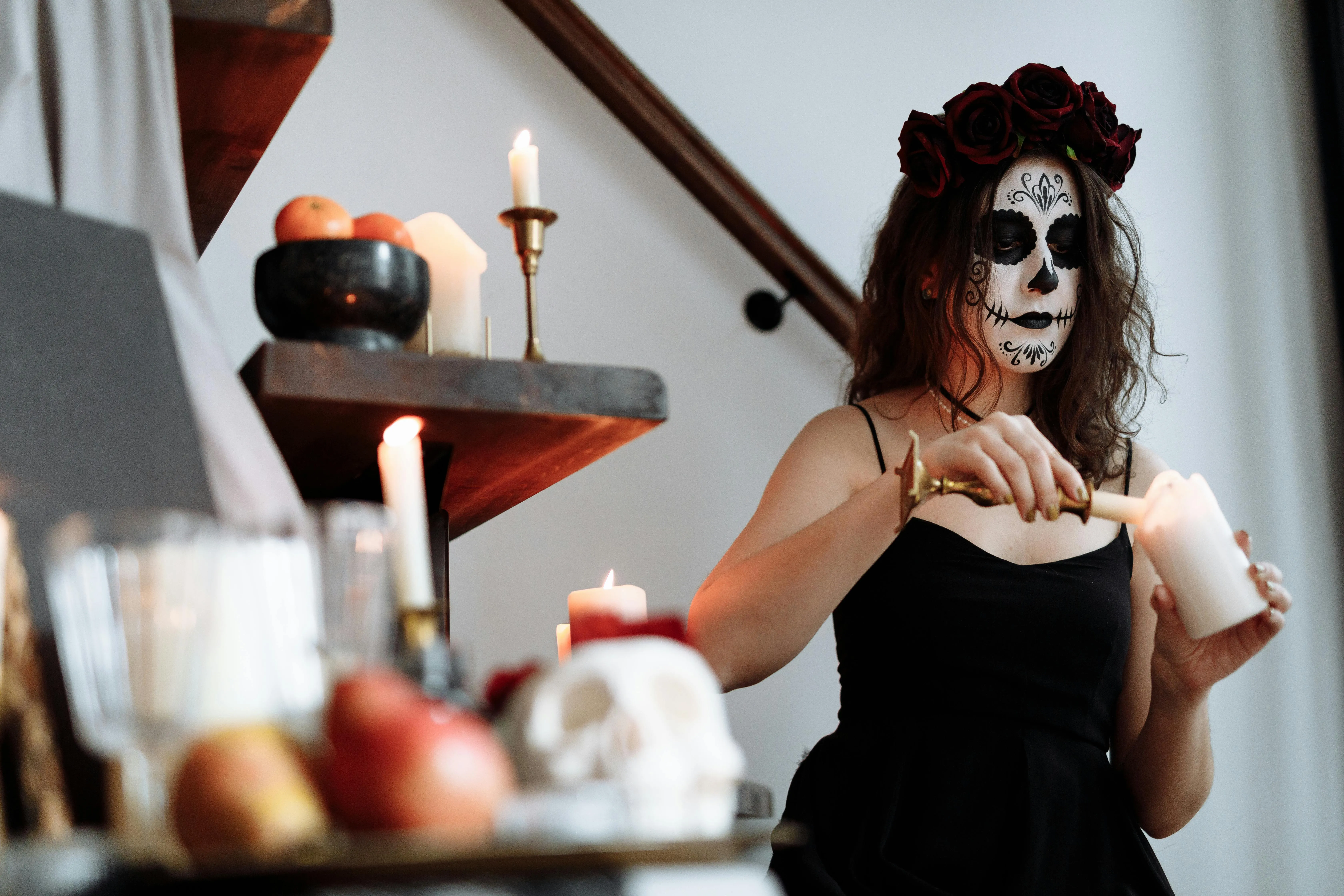 Woman lighting candle at Halloween Party Wallpaper HD