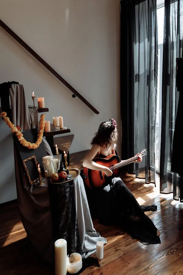 Woman Playing Guitar Beside Altar with Candles and Decor