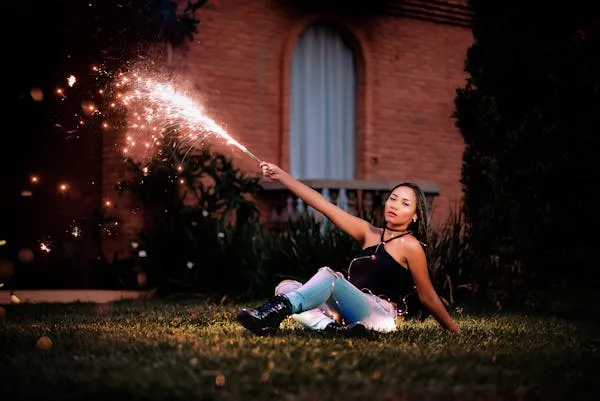 Woman Playing with Sparkler Creating Long Light Trails