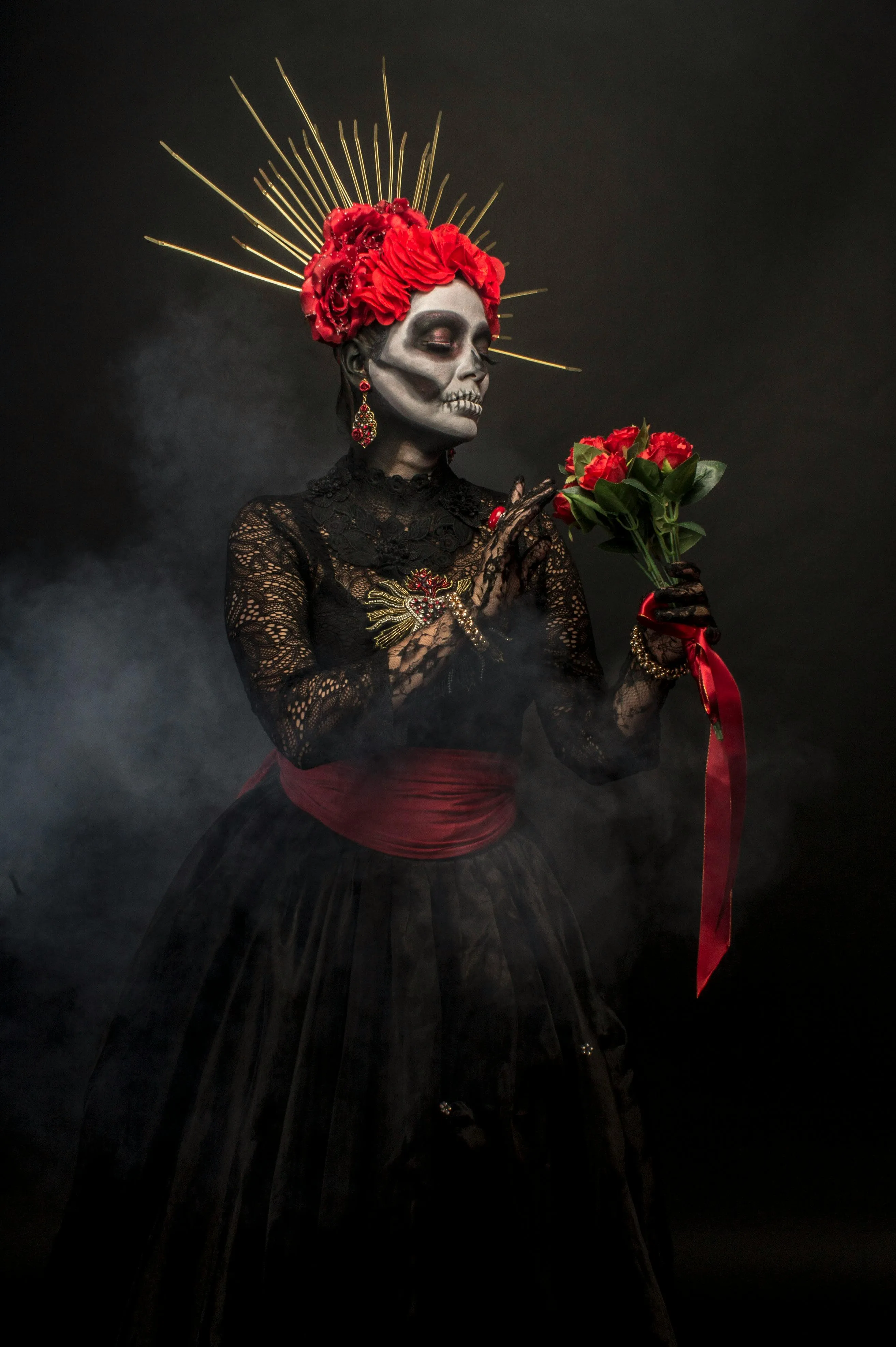 Woman Wearing Black Dress with Red Floral Headpiece