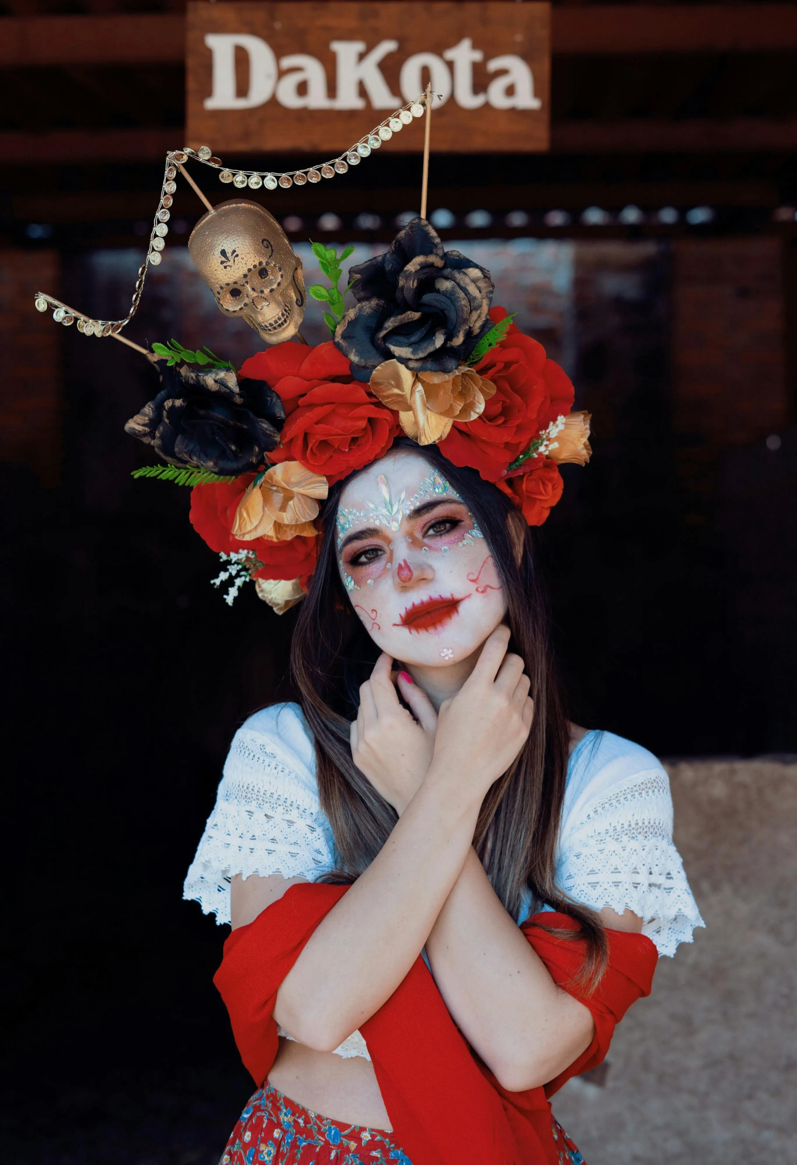 Woman Wearing Flower Crown and Sugar Skull Face Makeup