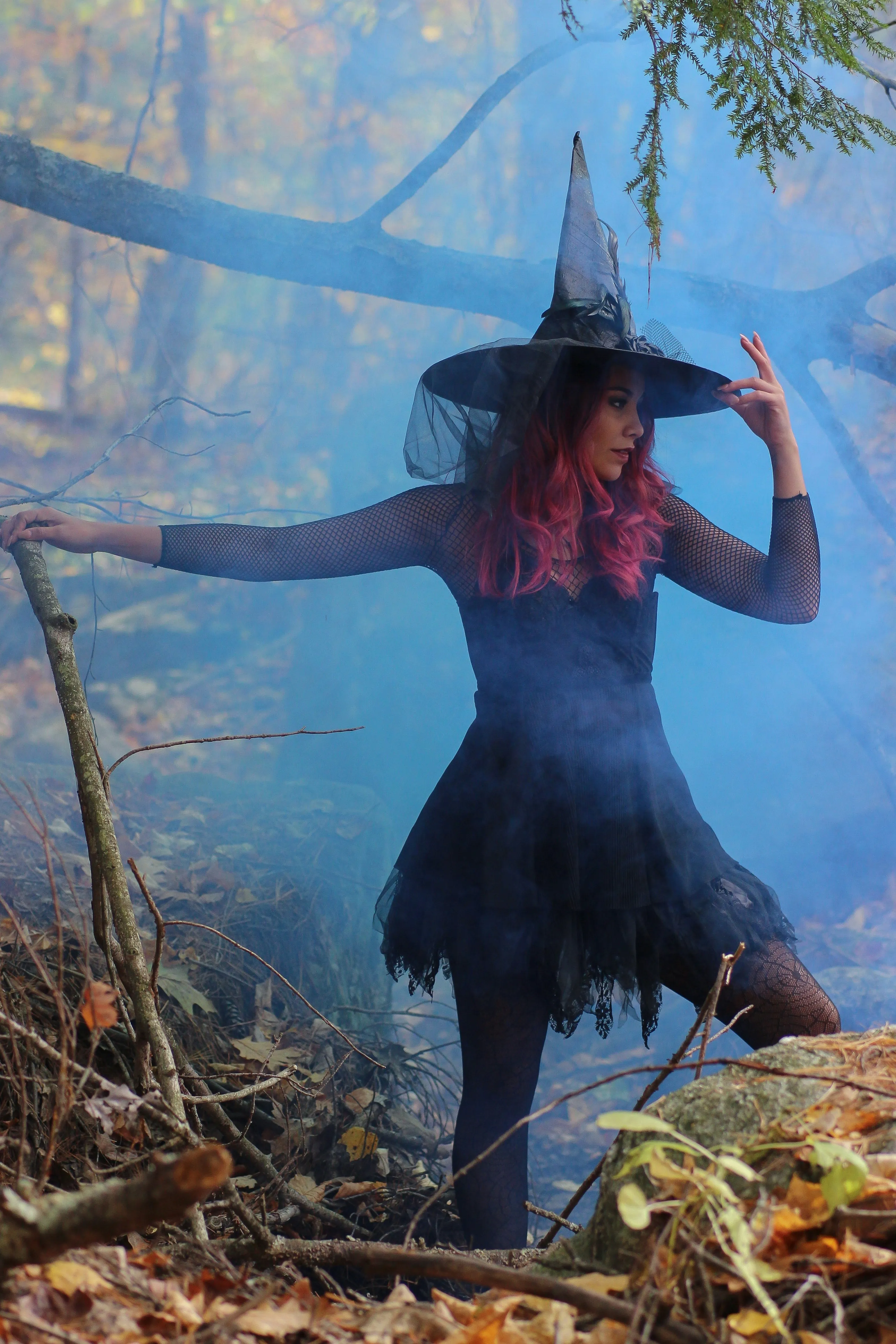Woman Wearing Witch Costume in Foggy Forest Wallpaper