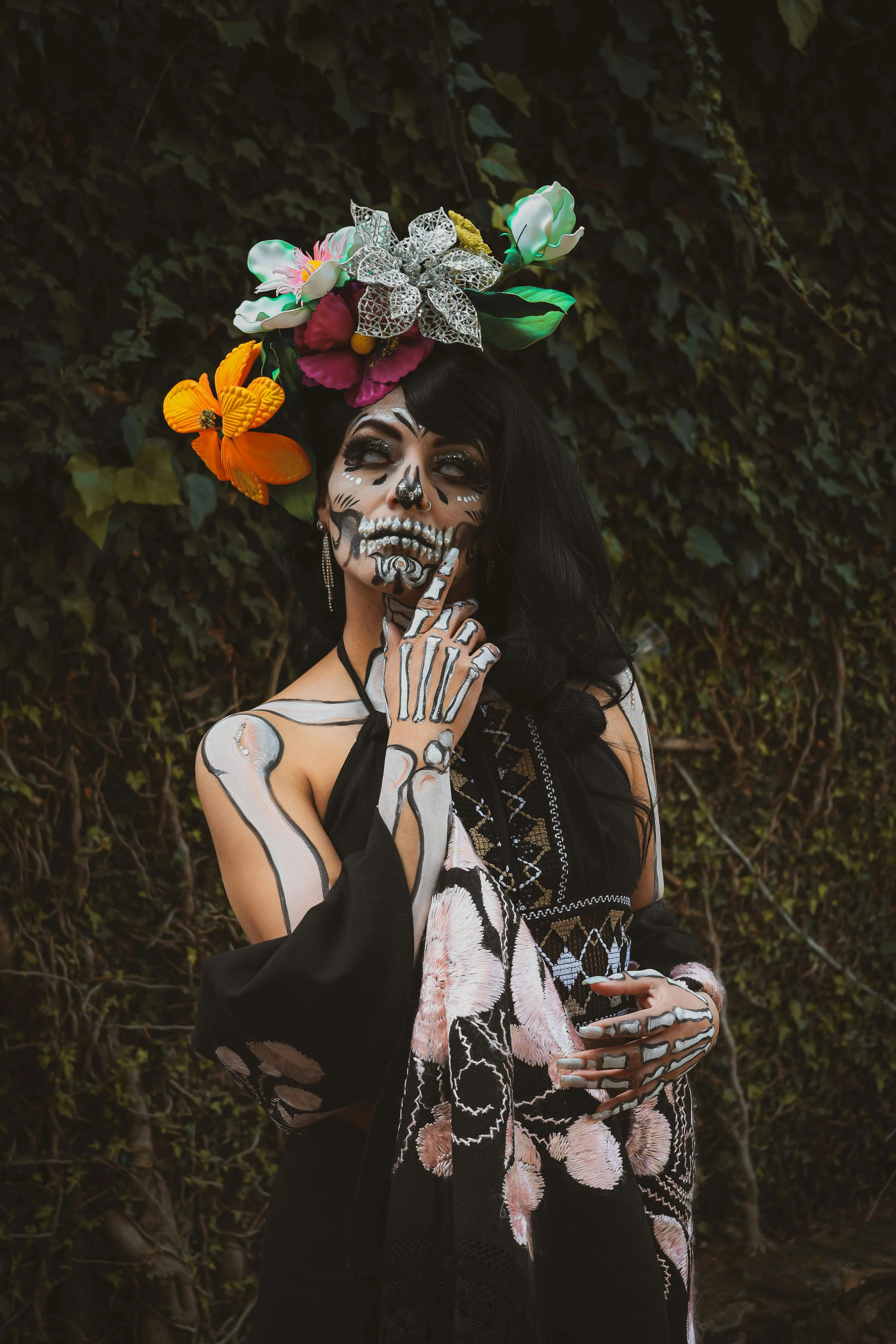 Woman with Dark Floral Makeup for Halloween Festival