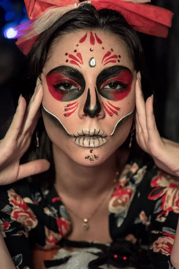 Woman with Day of the Dead Makeup and Pink Flower Headband