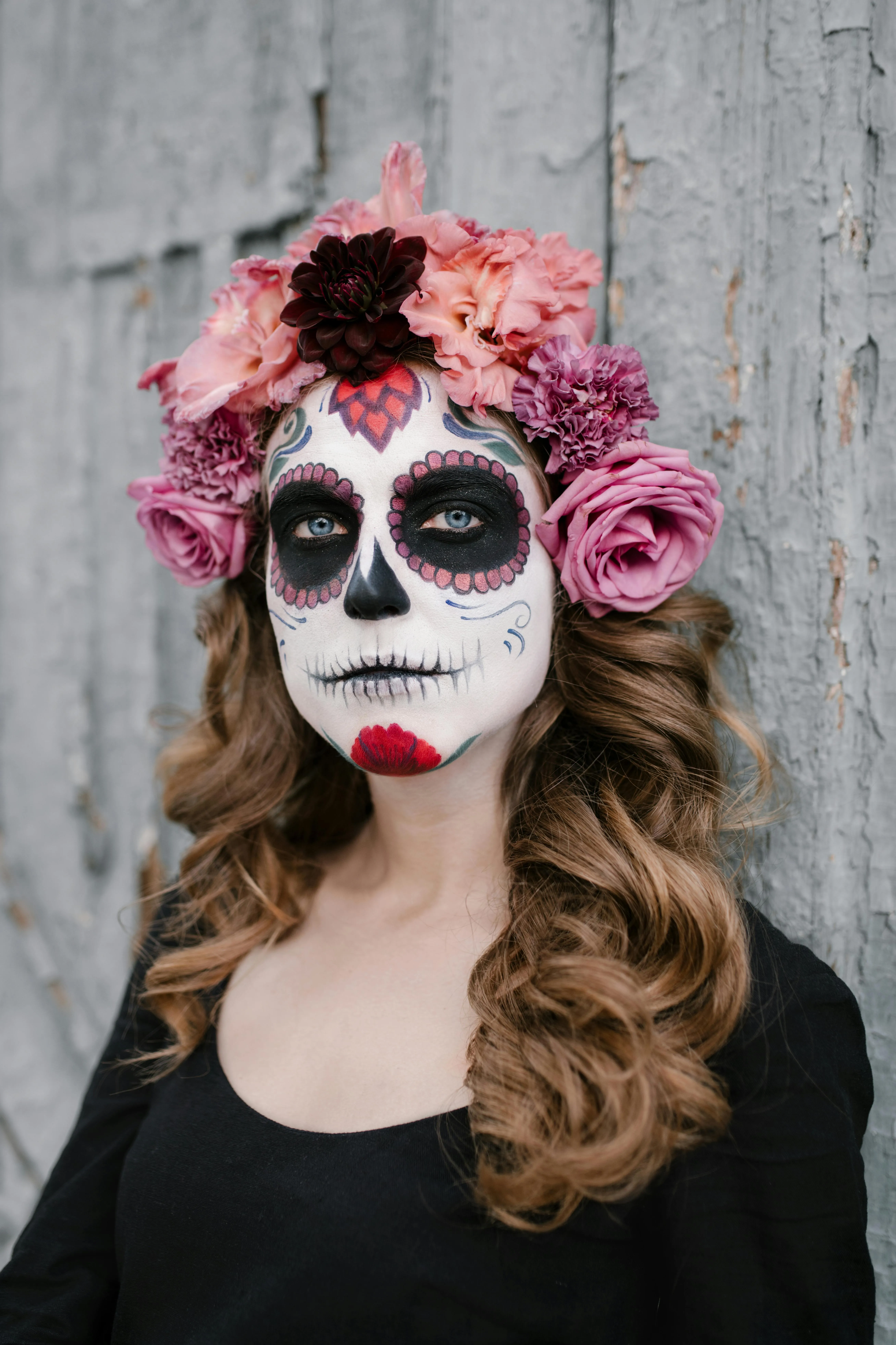 Woman with Floral Crown and Face Paint Halloween Look