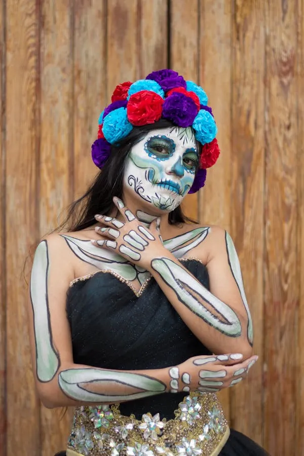Woman with Floral Crown and Skeleton Makeup Wallpaper