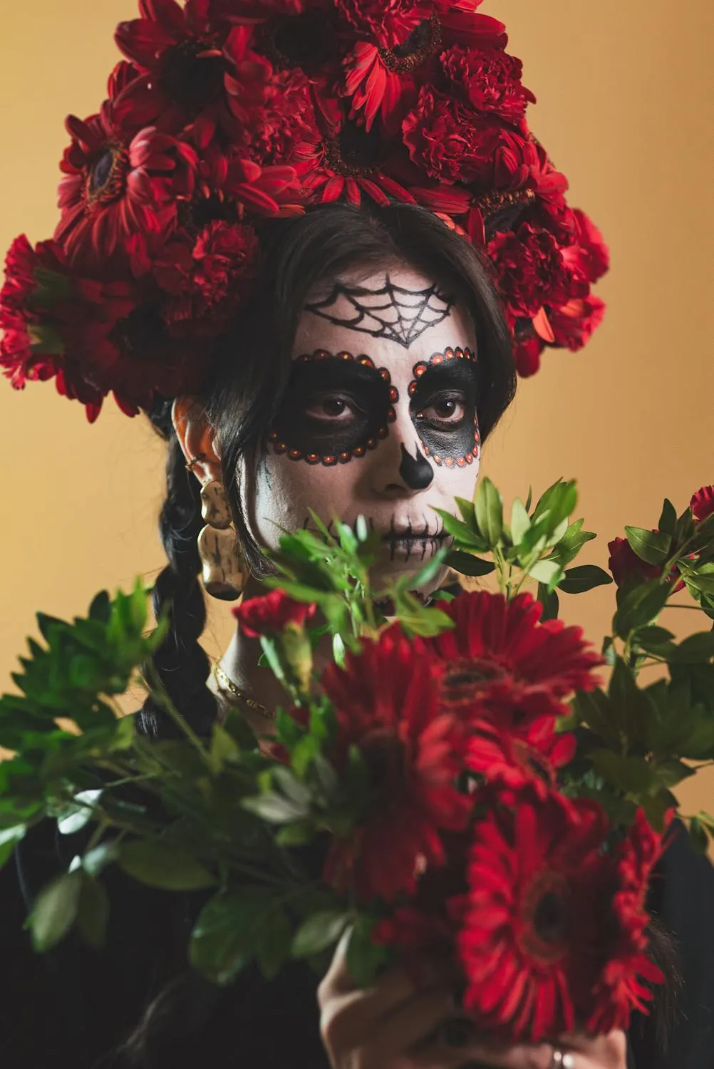 Woman with Floral Headpiece and Skull Makeup for Halloween