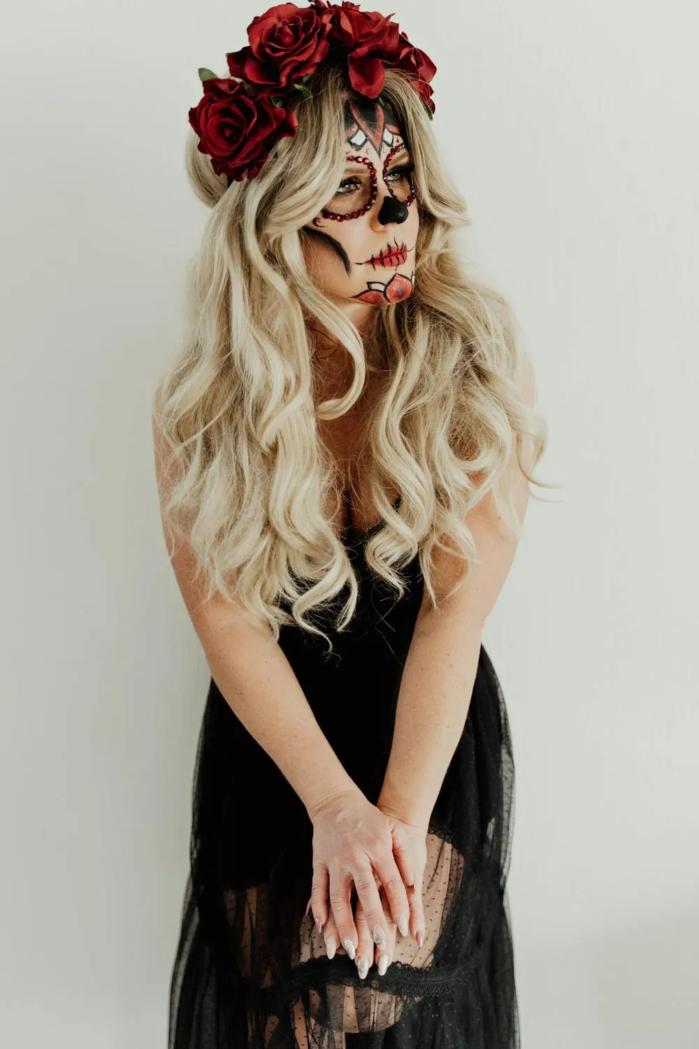 Woman with Halloween Makeup and Red Floral Headpiece