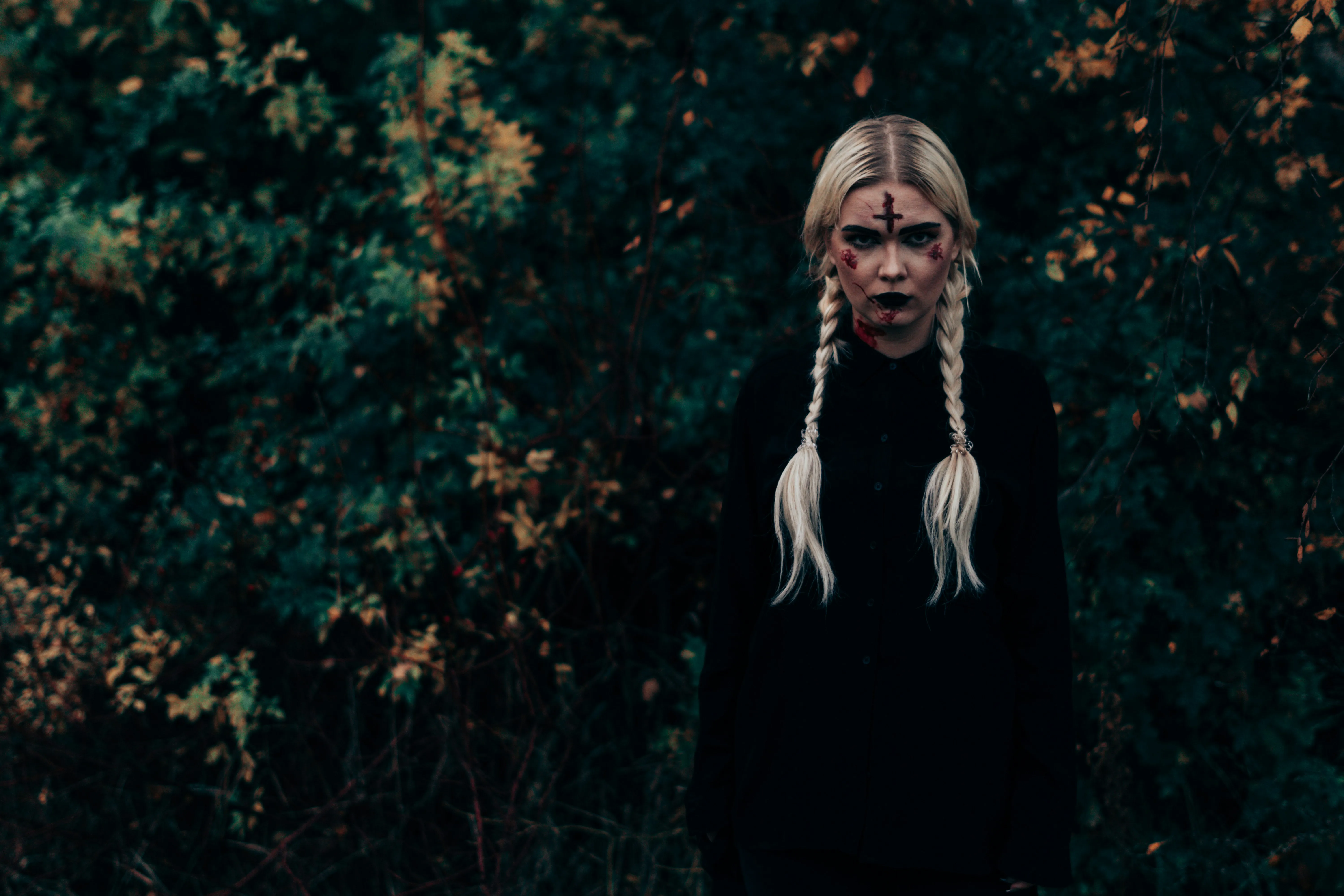 Woman with Long Blonde Hair in Dark Forest Halloween
