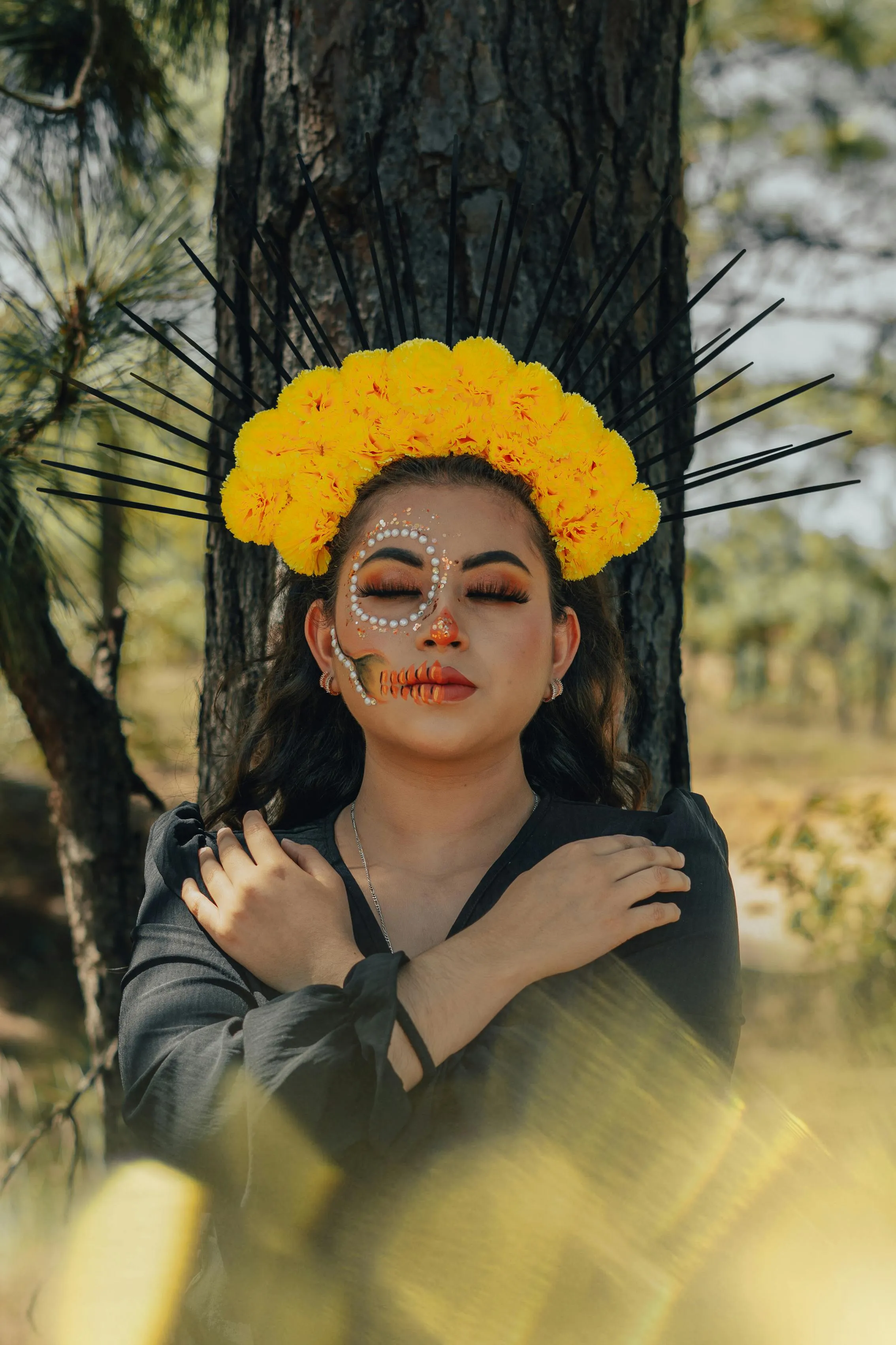 Woman with Marigold Crown and Face Paint in Nature Setting